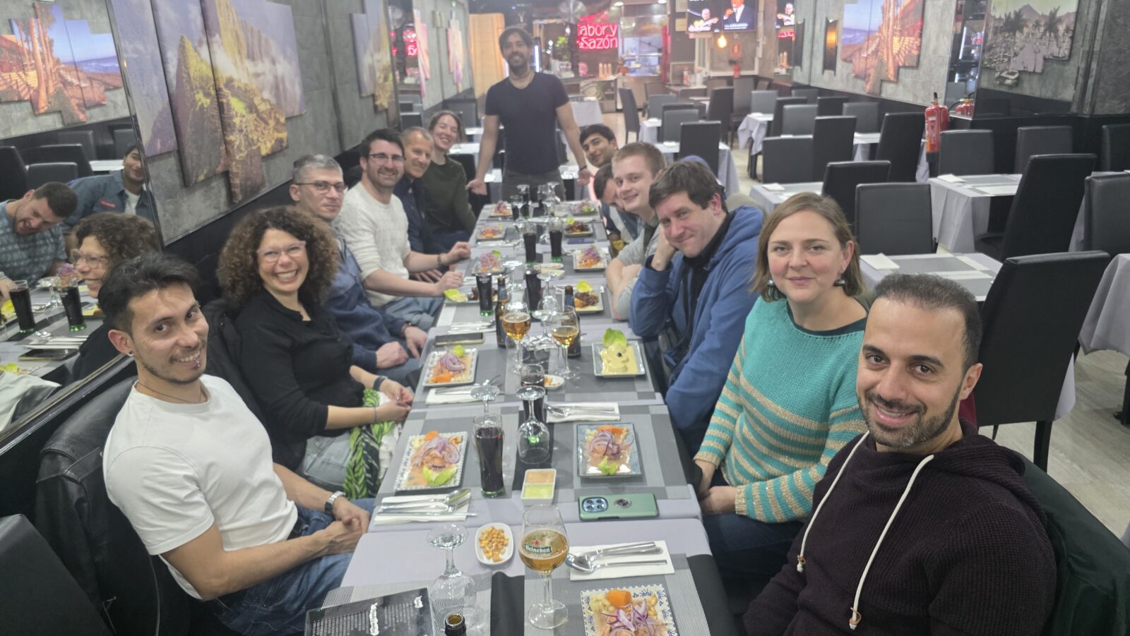 International meetup group enjoying Peruvian cuisine dinner at Kenko restaurant in Barcelona